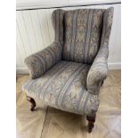 A late Victorian Howard style upholstered armchair