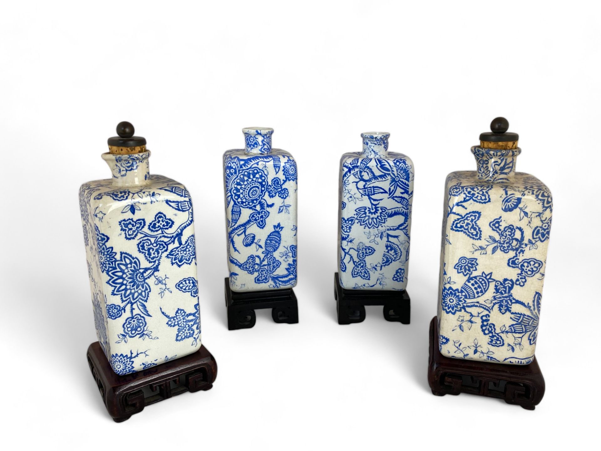 Two pairs of Liberty's blue and white foliate transfer printed bottles on Chinese hardwood stands - Image 4 of 7