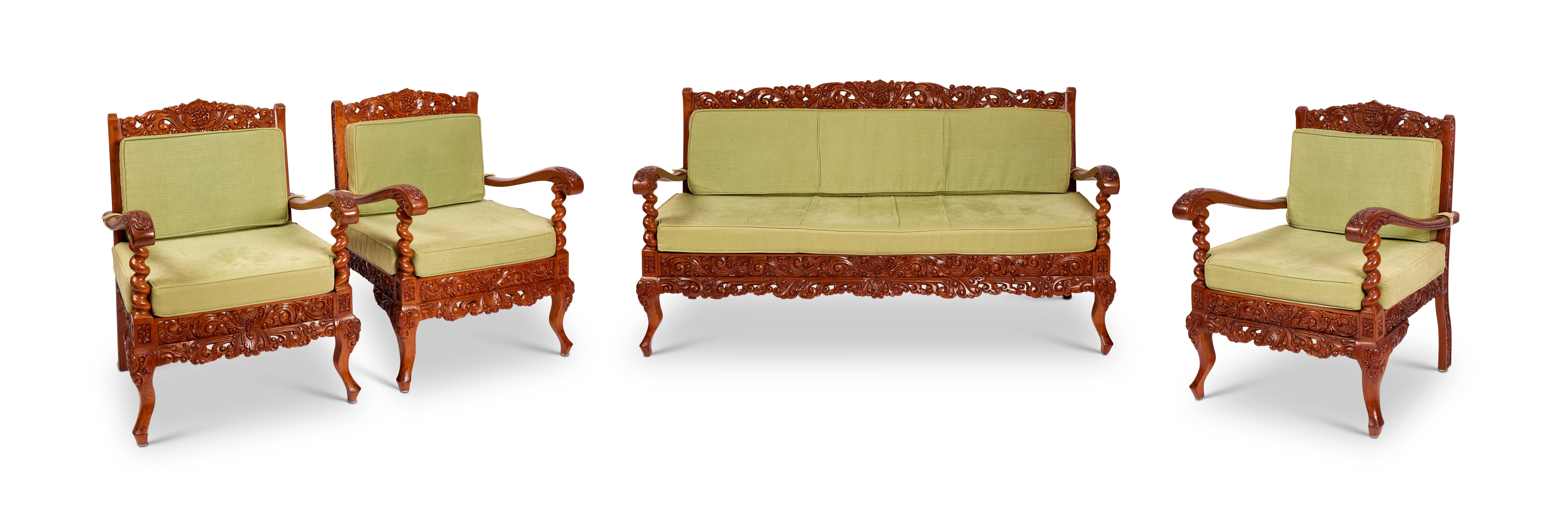 A Jepara carved hardwood four-piece salon suite comprising a settee and three armchairs