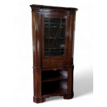 A mahogany and boxwood inlaid corner cupboard, late 18th century and later