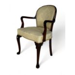 A late 19th century carved mahogany open armchair in the Georgian style