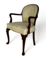 A late 19th century carved mahogany open armchair in the Georgian style