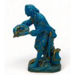 A 19th century Minton turquoise and gilt porcelain figure of 'Le jardinier au plantoir' in the Sèvre