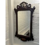 A 19th century mahogany and parcel gilt fret carved mirror in the George II style