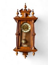 A late 19th century Vienna spring driven regulator oak cased wall clock