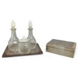 A sterling silver box and a continental cruet with a silver Art Deco stand