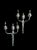 A pair of silver electroplated twin branch wall lights