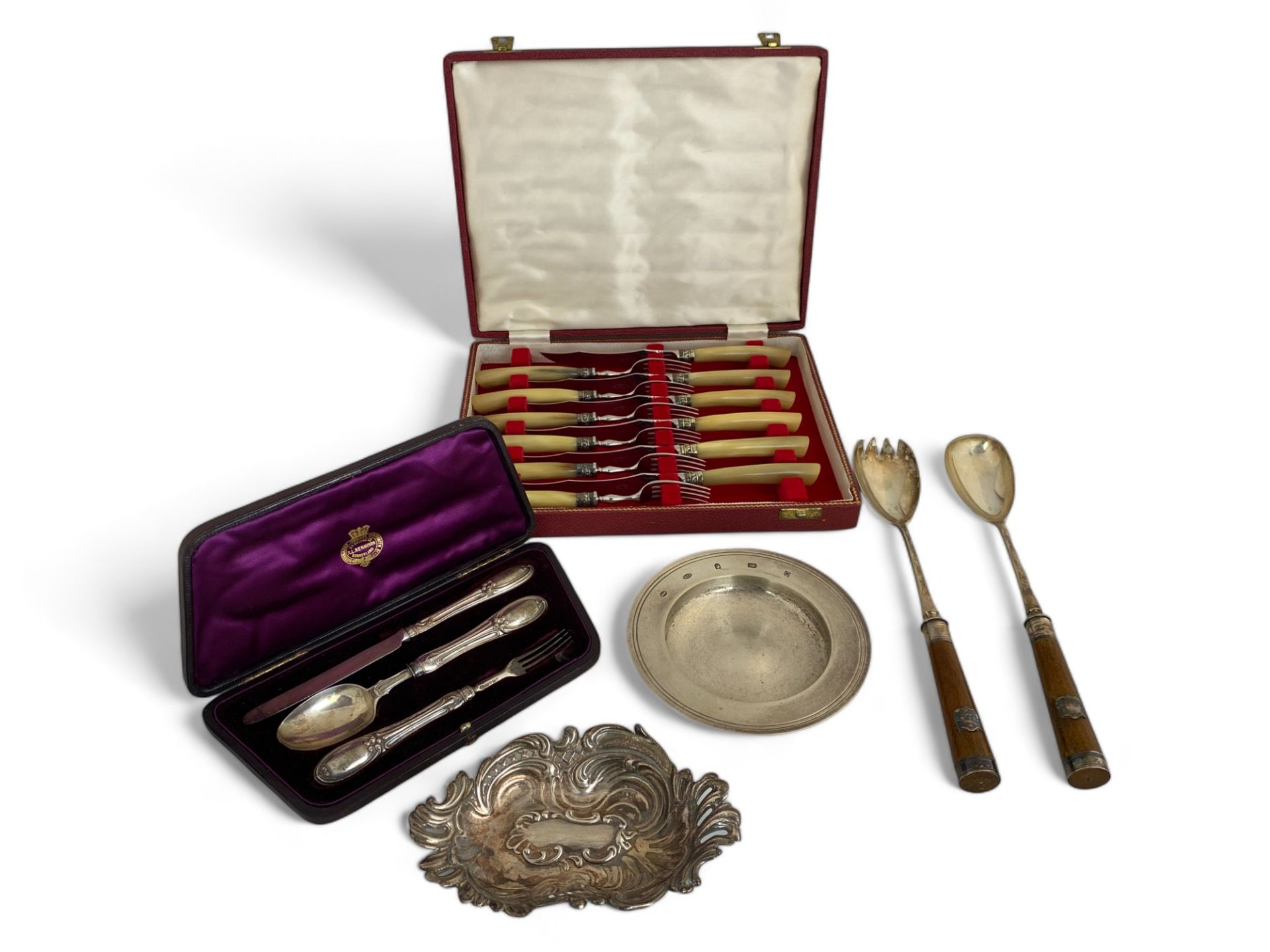 Two silver dishes, a cased set of silver child's cutlery, an early 20th century cased bone handled s