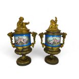 A pair of 19th century French gilt bronze mounted Sevres style turquoise glazed porcelain urns and c