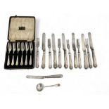A silver cased set of cake forks, a silver knife and silver straining spoon, together with a set of