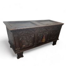 A large 17th century carved stained pine chest, Northern European