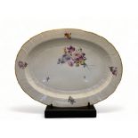An early 19th century Continental white glazed oval meat plate