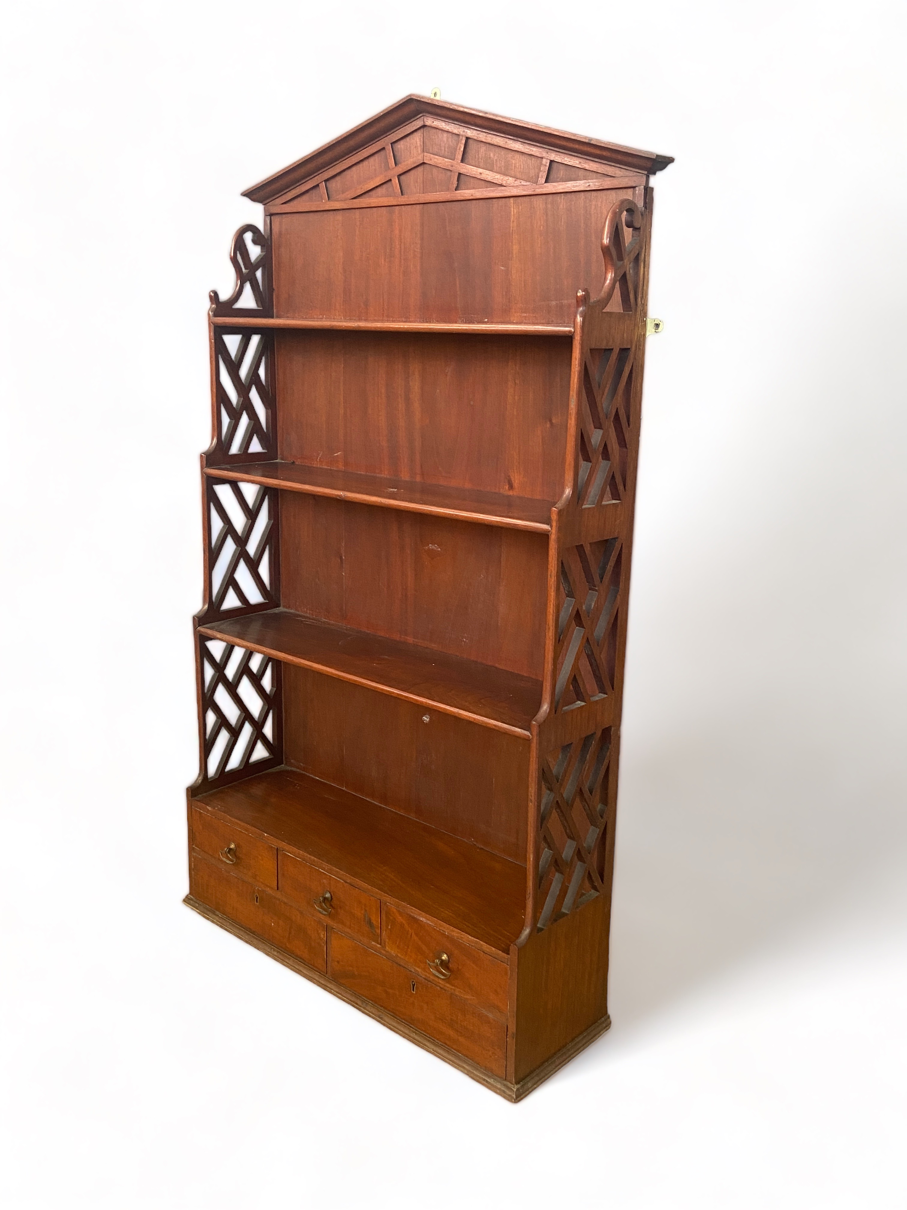 A George III style mahogany hanging shelf in the Chippendale style