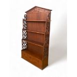 A George III style mahogany hanging shelf in the Chippendale style