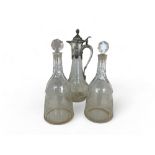 A pair of late George III cut glass taper decanters and a late 20th century claret jug