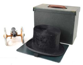 A vintage silk top hat by Austin Reed, inner circumference 57cms, with box together with a model