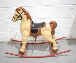 A vintage metal child's rocking horse.