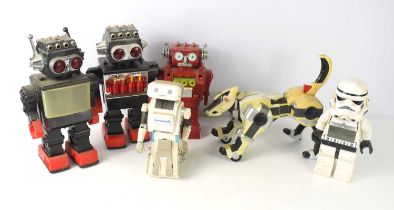 A collection of vintage battery operated toy robots together with a battery operated Lego "