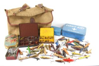 A collection of vintage fishing items, including lures, flies, weights and rod rings, all