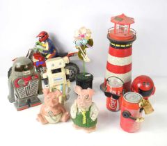 A group of vintage toys to include novelty Cola Cola musical cans, Wade Natwest piggy banks,