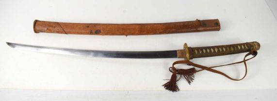 A WWII Japanese Officers sword and leather scabbard, with signed tang, gilt tsuba, shagreen handle