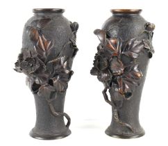 A pair of Japanese bronze vases, with relief decoration depicting a butterfly among a sprays of