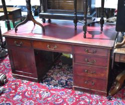 A large Victorian mahogany pedestal desk with red leather top, one side with pedestal of four