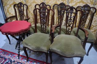 A set of six mahogany dining chairs, including two carvers, with carved and pierced splats, and