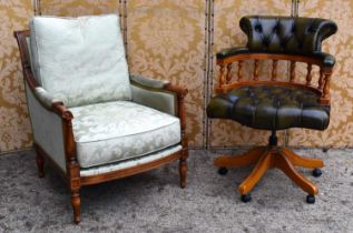 A Wesley Barrell mahogany framed armchair upholstered in Balmoral Damascus fabric and raised on