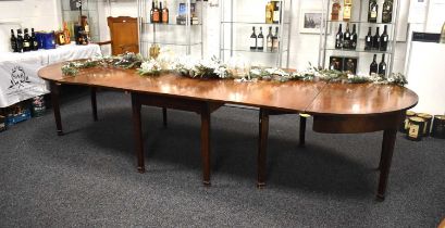 A large Victorian four piece mahogany dining table, 460cms when extended, 138cms wide