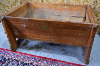 A large antique pine dough bin, bearing brass plate 'Installed by Hoods Utensils', 71 by 138 by