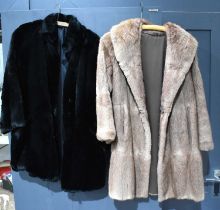 A vintage musquash ¾ length coat, and a black rabbit fur coat,