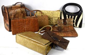 A group of collectable handbags and purses to include crocodile, ostrich and other examples.