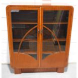 A 1920s mahogany twin door glass display cabinet, reputedly made by Henry Simpson Dellow, cabinet