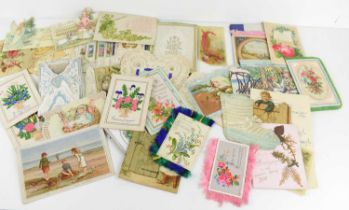 A collection of late 19th century Victorian and later Christmas and greetings cards, including a