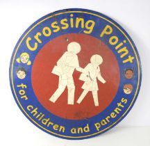 A vintage Crossing Point for Children and Parents metal sign.