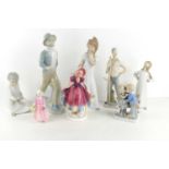 A group of porcelain figures to include Lladro Nao, Royal Doulton, Dipa and others.