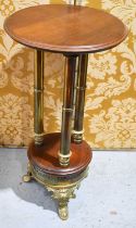 A 20th century brass and mahogany hall table / jardiniere stand, the circular top raised on three