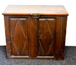 An 18th century and later box, the early panelled front having a 19th century hinged lid with hoop