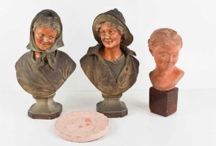 A pair of early 20th century chalkware pottery busts, peasants, one stamped BU 525 verso, together