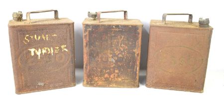 Three vintage petrol cans, Esso and Shell.