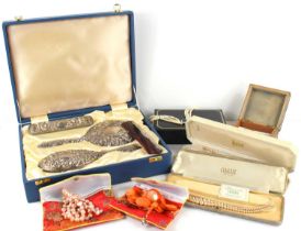 A group of jewellery to include pearl necklaces together with a silver dressing table set.
