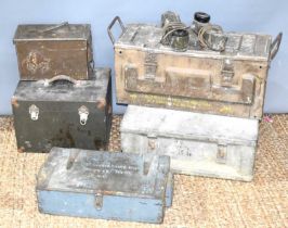 A group of military wooden and metal ammo storage boxes together with two military field