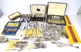 A collection of vintage flatware to include silver plated and boxed examples.