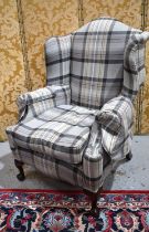 A 20th century wingback armchair, in tweed upholstery., 120cm high.