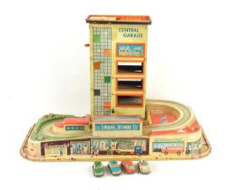 A vintage 1950s / 60s Technofix tin plate and plastic Central Garage with four cars.