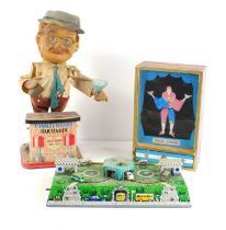 A group of vintage toys to include a battery operated Charlie Weaver Bartender, wind up Magic Dancer
