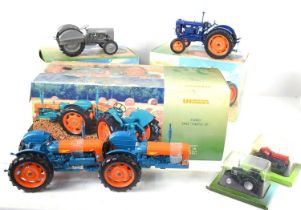 Three boxed 1:16 scale models of tractors by Universal Hobbies comprising of a Ford Doe, Fordson