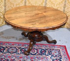 A fine 19th century rosewood centre table, the circular top having a shaped apron, the base with