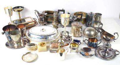 A large group of silver plate, including ice bucket, white metal dish set with a silver Maria